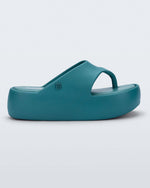 Side view of a teal Free Platform Thong sandal