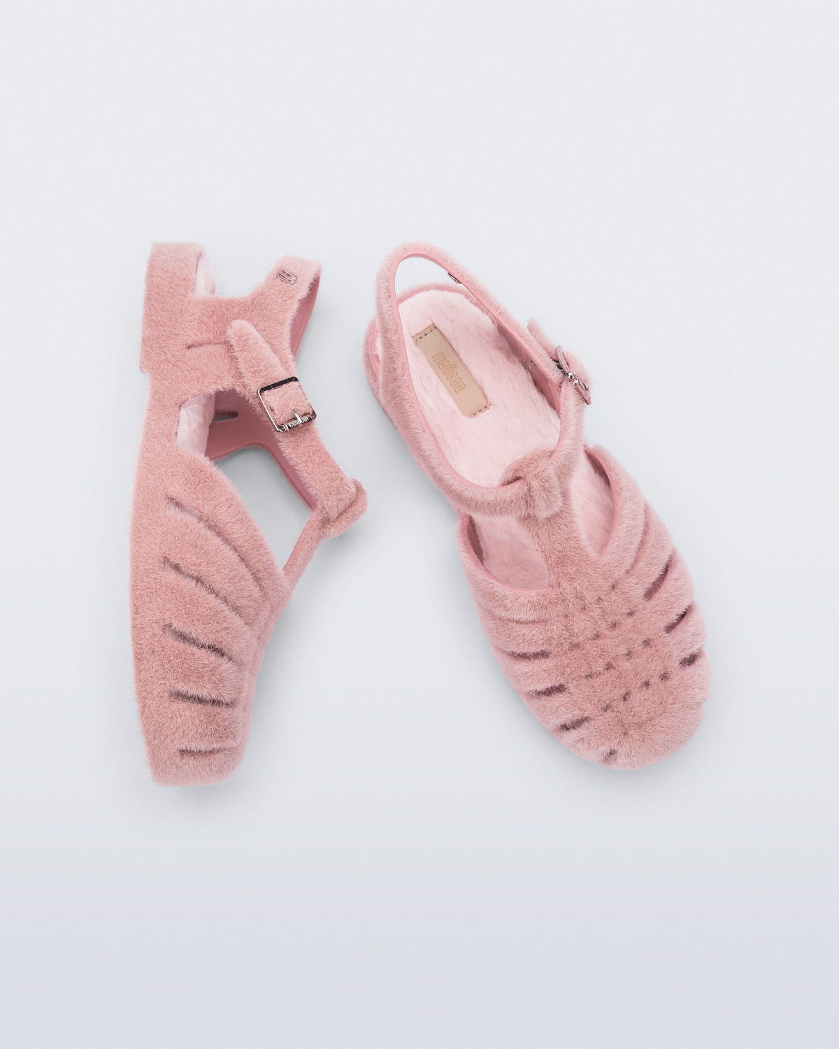 Top and side view of a pair of pink fuzzy Possession Warm fisherman sandals with fuzzy insoles