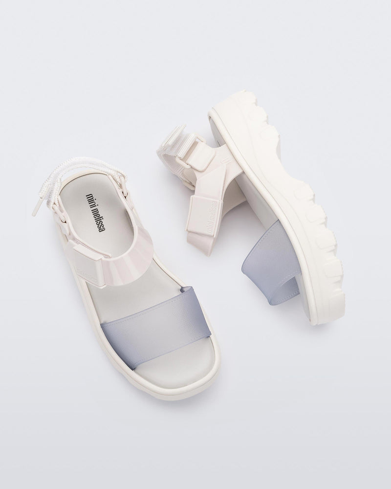 Top and side view of a pair of Mini Melissa Kick Off platform sandals in white with adjustable velcro ankle straps
