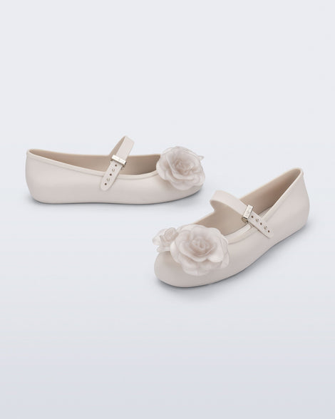 Angled and side view of a pair of beige Soft Ballerina Petals flats