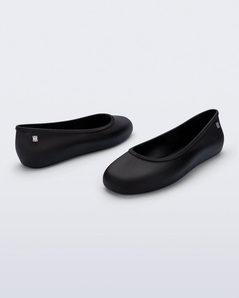 Back and angled view of a pair of black Soft Ballerina Essential flats