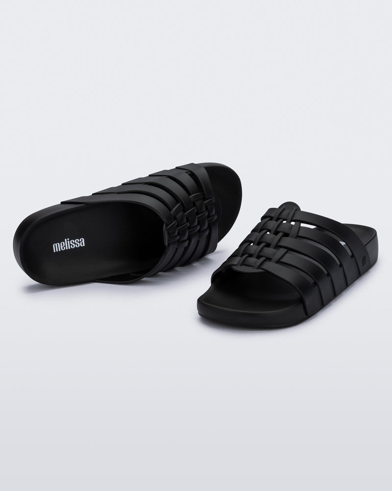 Top and angled view of a pair of black Possession Slide