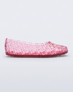 Side view of a clear pink Possession Ballerina flat
