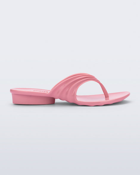 Side view of a pink Flip Flop + Diesel sandals