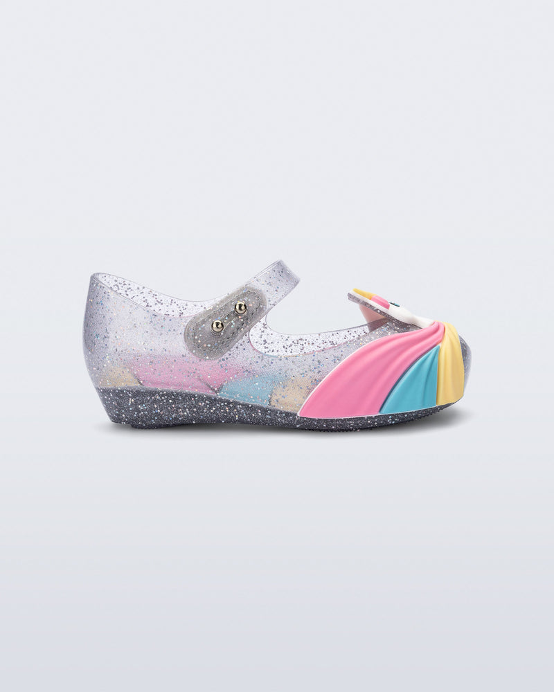 Side view of a glitter clear/pink baby Ultragirl Unicorn flat