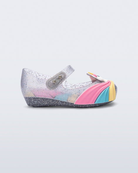 Side view of a glitter clear/pink baby Ultragirl Unicorn flat
