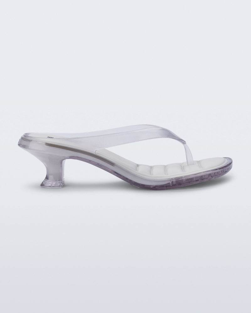Side view of a clear Flip Flop Kitten Heel with white insole