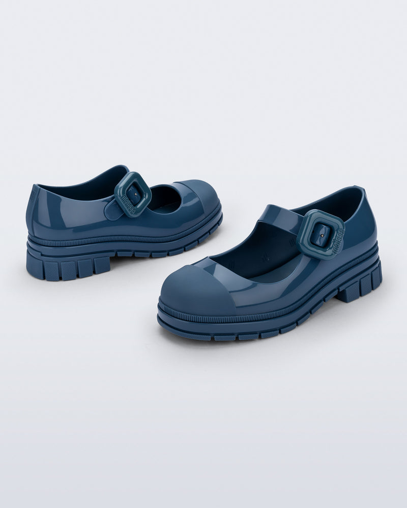 Back and side angle view of a pair of blue June mary janes with matte toe cap