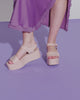 Video with no sound of a model in a purple outfit wearing a pair of light pink Mar Platform Sandals.