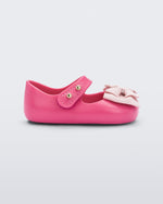Side view of pink My First Melissa mary jane with a pink bow.