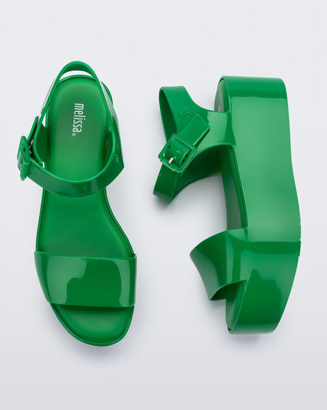 A top and side view of a pair of green Melissa Mar Platform sandals with two straps.