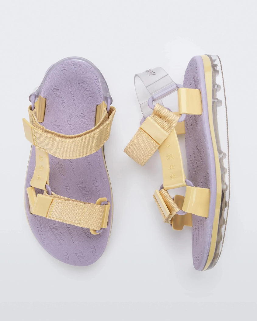 Top and side view of a pair of purple soled Melissa Papete sandal with yellow straps.