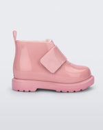 Side view of a pink baby Chelsea boot