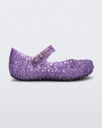 Side view of Mini Melissa Campana purple glitter flats with a snap strap for baby with an open woven texture