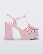 Side view of a Melissa Tie Party platform heel in Pink with 3D bow detail and ankle strap with buckle.