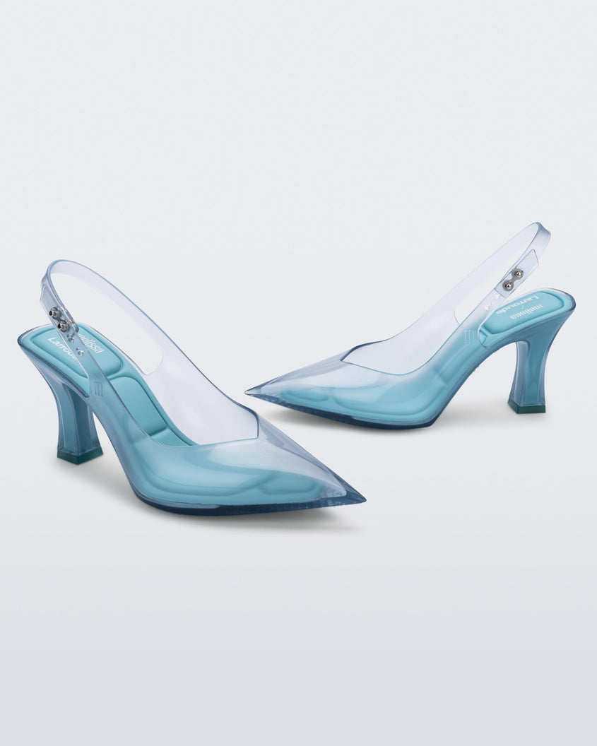 Angled view of a pair of Melissa Slingback shoes in transparent blue with a pointed toe and square shaped heel