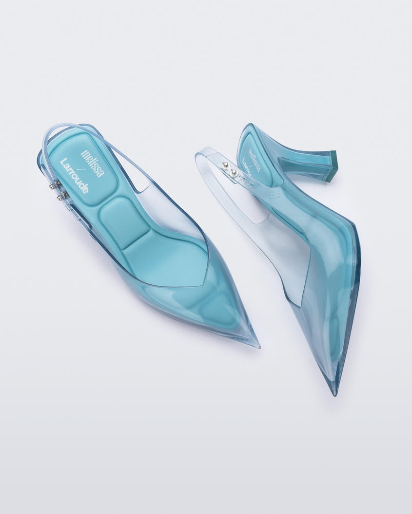 Top and side view of a pair of Melissa Slingback shoes in transparent blue with a pointed toe and square shaped heel