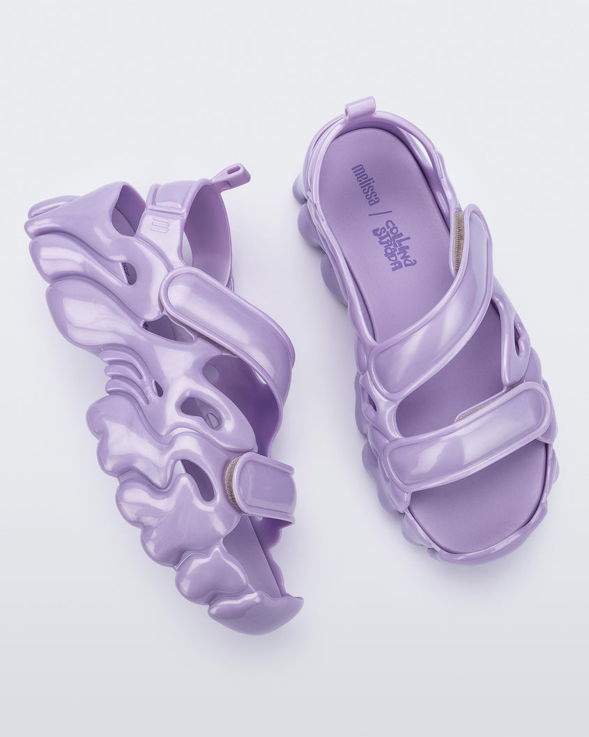 Top and side view of a pair of Melissa Puff chunky sandals in lilac with velcro straps