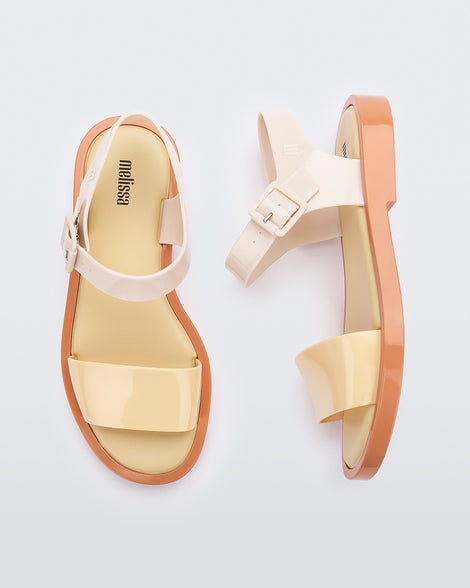 A top and side view of a pair of beige/yellow Melissa Mar Sandal with two straps.