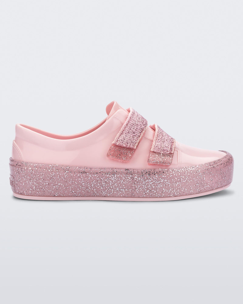 Side view of a Pink/Pink Glitter Mini Melissa Beanny Bugs sneaker with a pink base, two shiny pink velcro straps and a pink glitter sole.