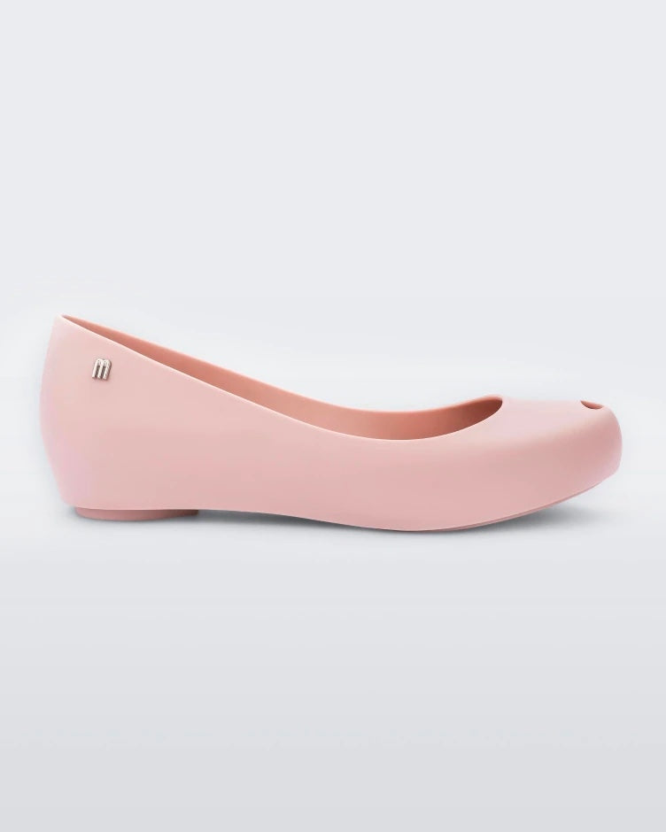 An outter side view of a light pink Melissa Ultragirl Basic flat