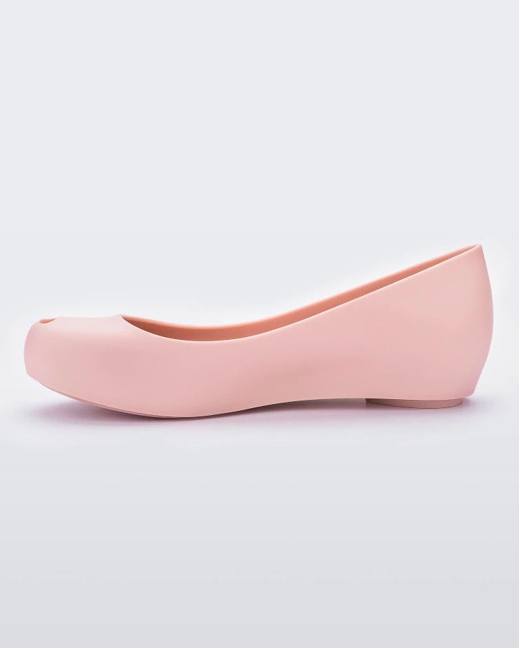 An inner side view of a light pink Melissa Ultragirl Basic flat