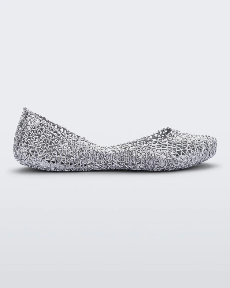Side view of a silver glitter Melissa Campana ballet flat.