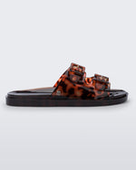 Side view of a Melissa Wide slide sandal with brown sole and Brown Tortoise colored straps