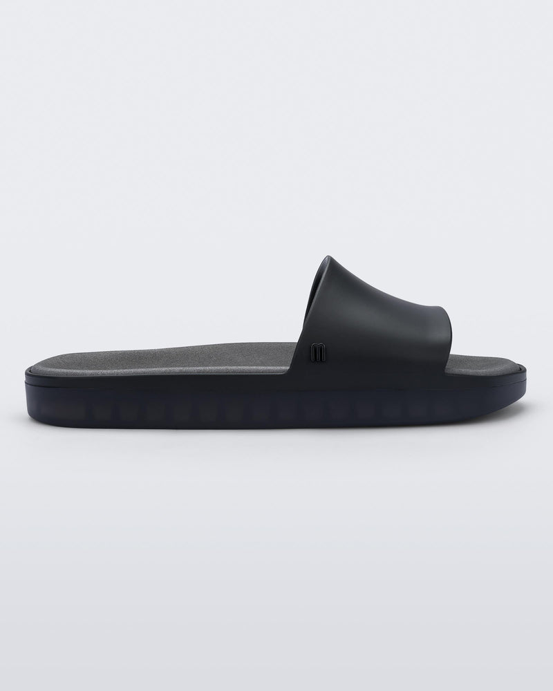 SIde view of black Melissa Beach slide.