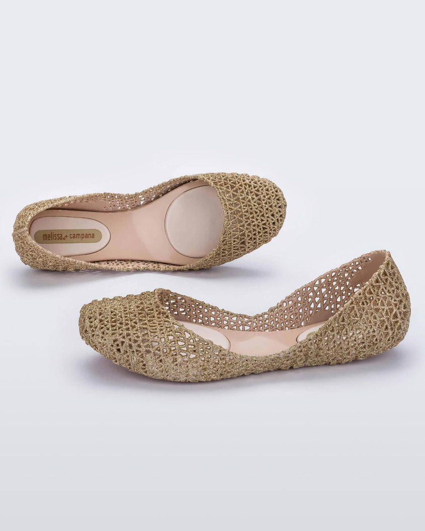 Top and angled view of a pair of beige Melissa Campana ballet flats