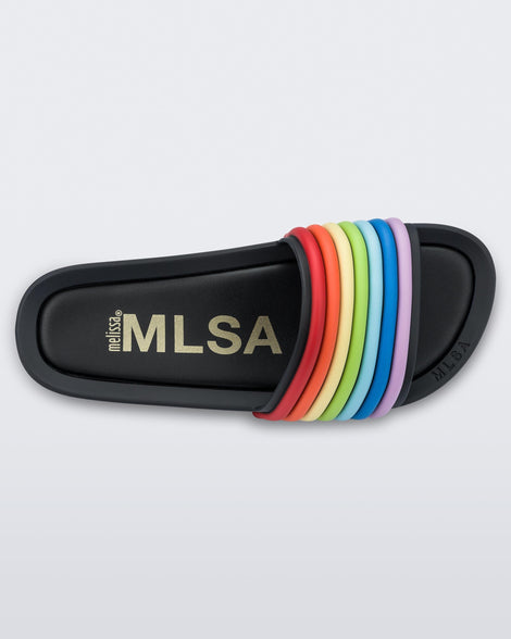 Top view of a black rainbow Melissa Rainbow Beach slide with a black base and a rainbow design on the front strap.