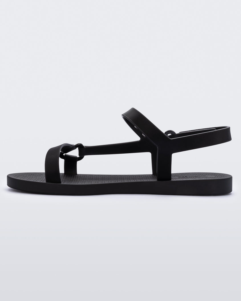inner side view of a Melissa Sun Downtown sandal in black with front cross and back ankle straps