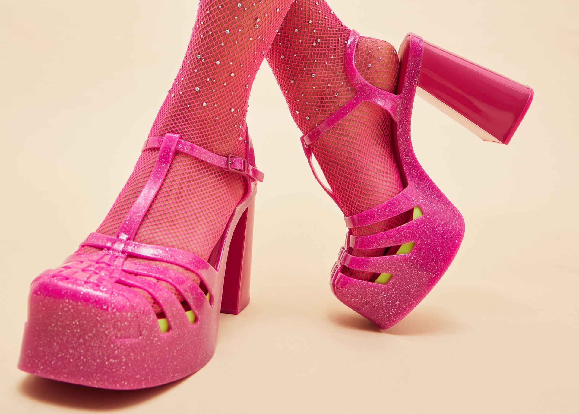 model wearing the pink party heel
