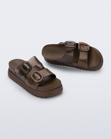 Top and angled view of a pair of brown Cozy Platform slide sandals with two buckle straps.