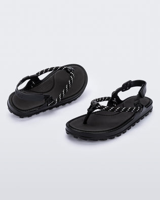 Angled view of a pair of black Bond sandals with textile strap and black toe piece