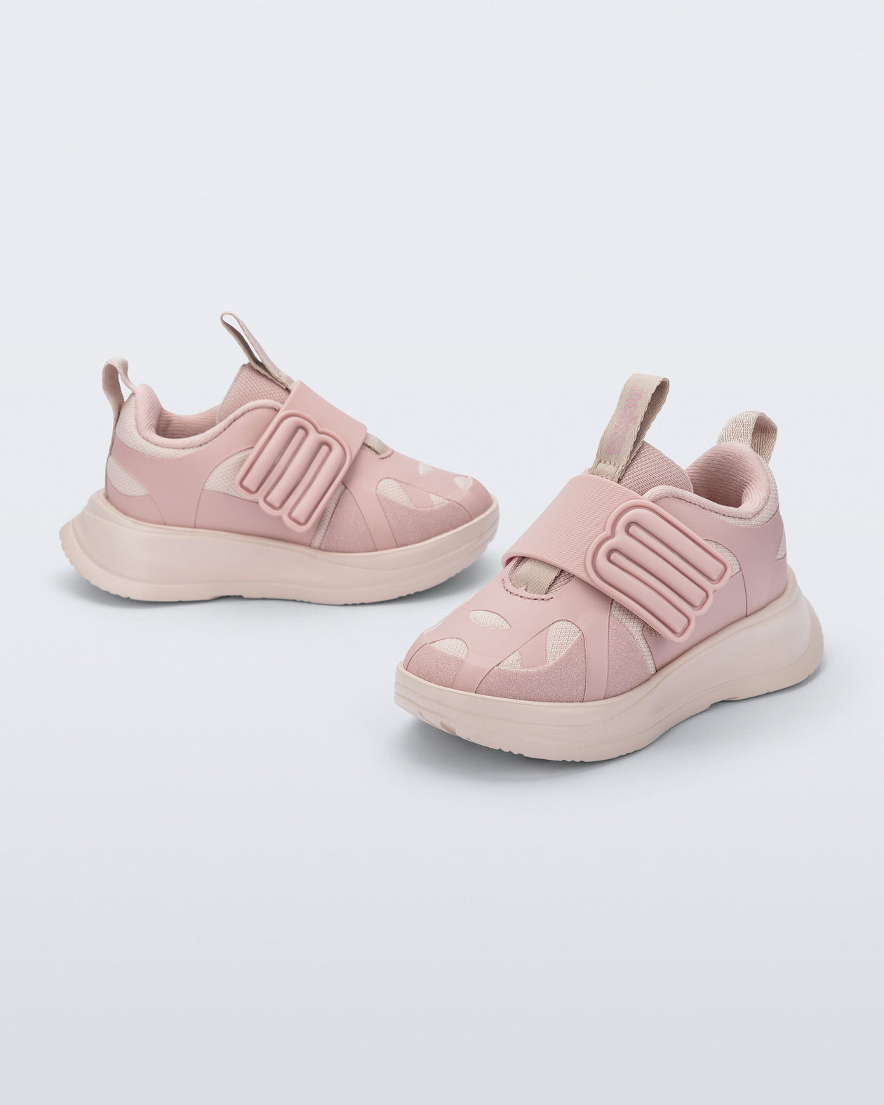 Side and angled view of a pair of pink X Beat baby sneakers