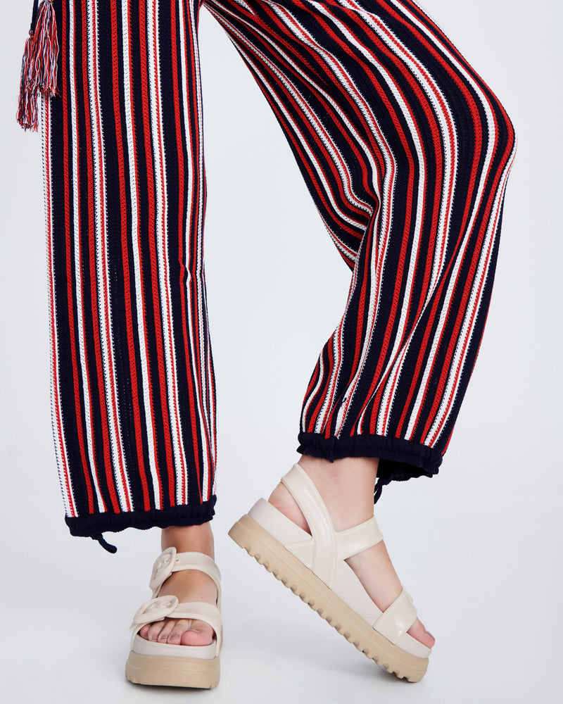 Model's legs wearing a pair of beige Cozy Sandal Platforms