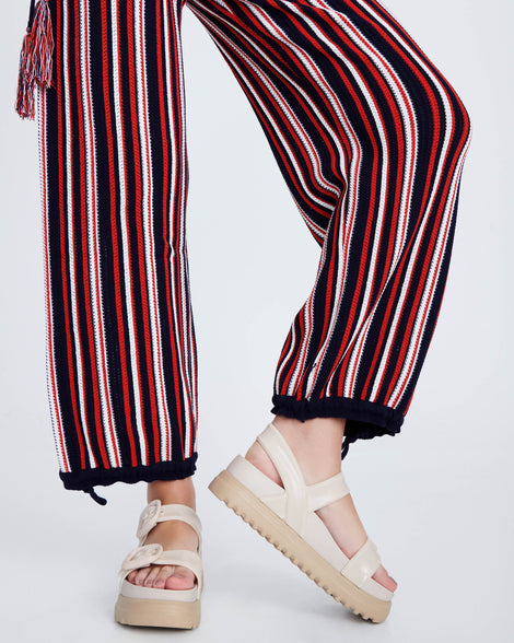 Model's legs wearing a pair of beige Cozy Sandal Platforms