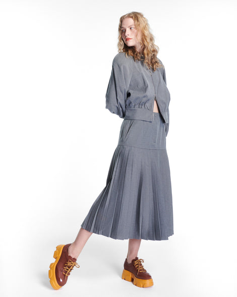 Model in a grey dress wearing a pair of brown Camp platform Sneakers with yellow laces and sole