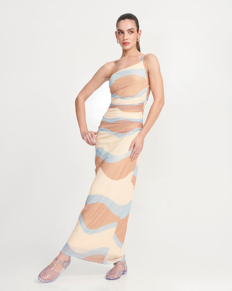 Model in a beige dress wearing a pair of clear Aranha 79 flats with buckle