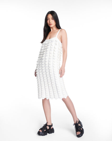 Model in a white dress wearing a pair of black Camp platform sandals with black laces