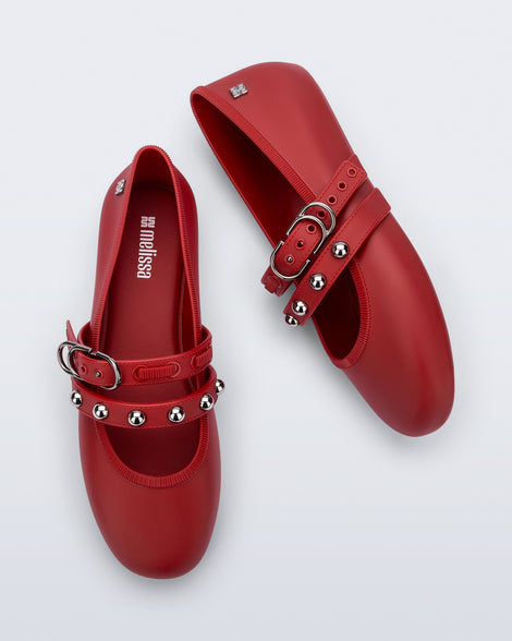 Top and side view of a pair of red Soft Ballerina Studs flats with silver embellishments