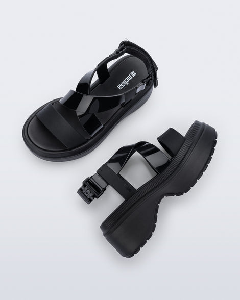 Side and top view of a pair of black Stand platform sandals