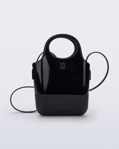 Front view of a black Ultra Bag with handle and strap