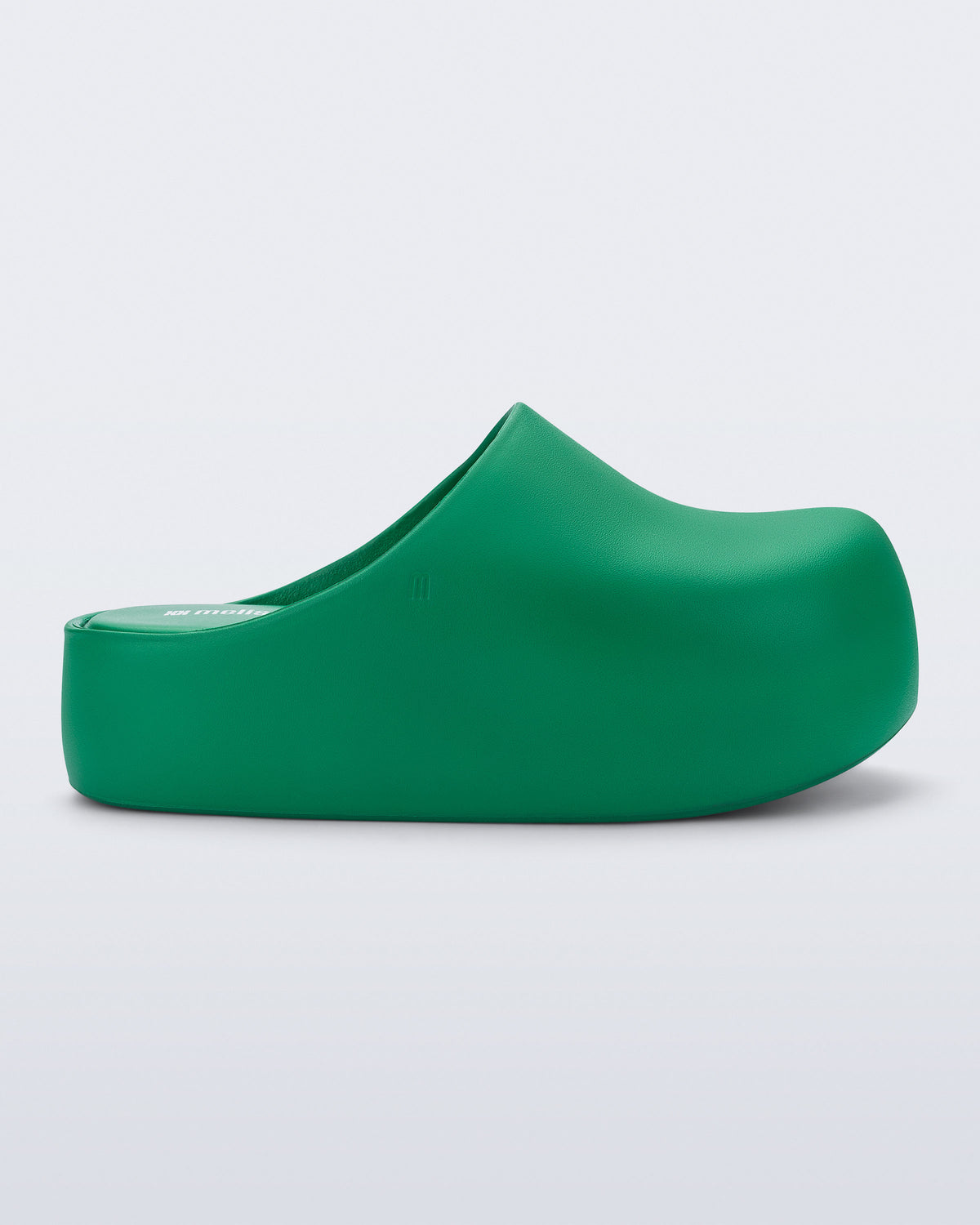 Side view of a green Free Clog Up Platform 