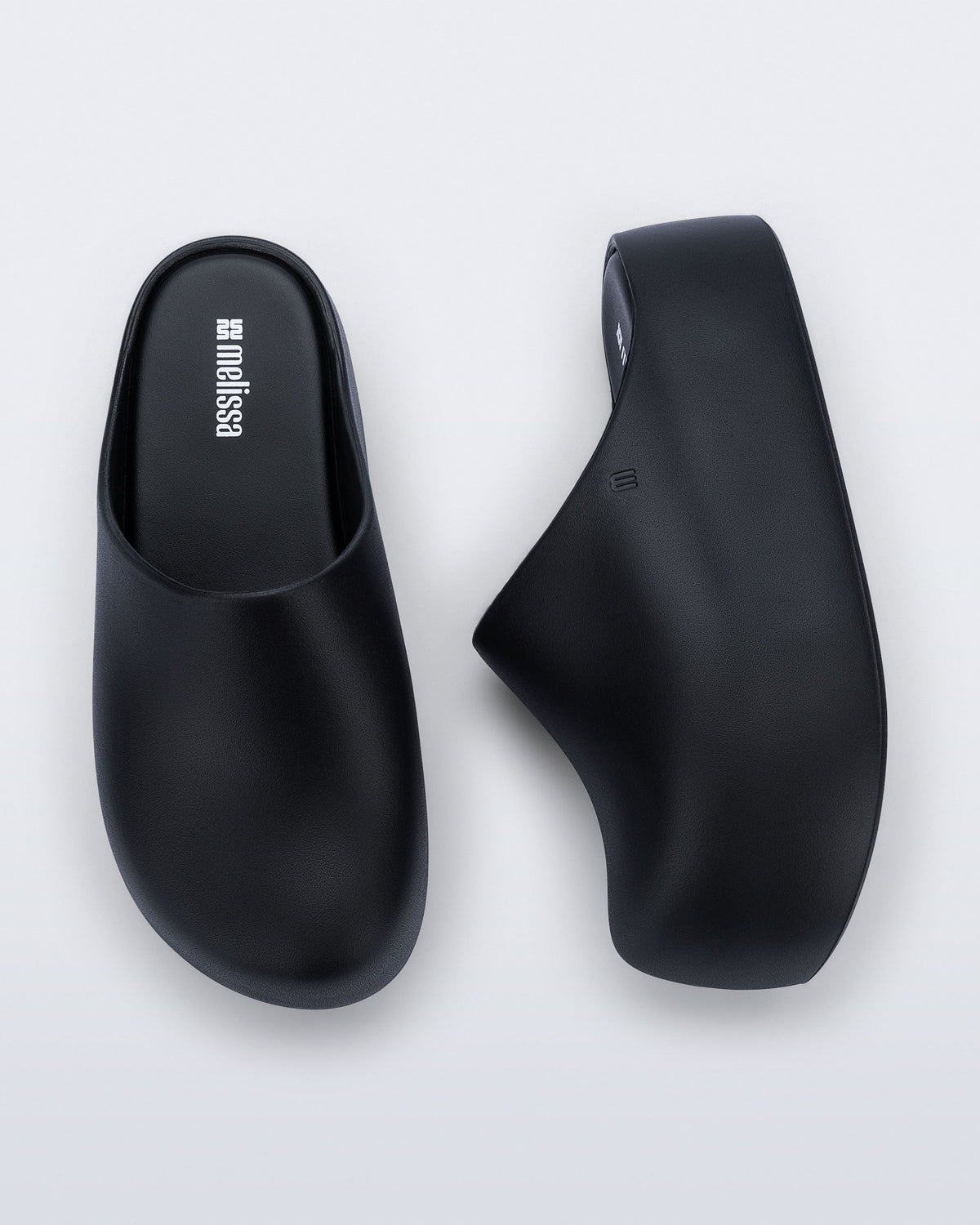 Side and top view of a pair of black Free Clog Up Platforms