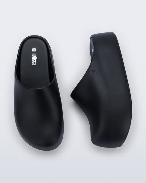 Side and top view of a pair of black Free Clog Up Platforms