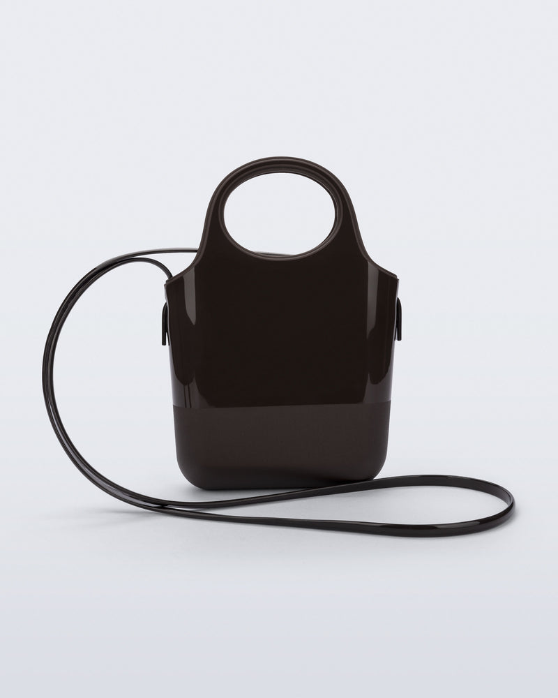 Back view of a brown Ultra Bag with handle and strap