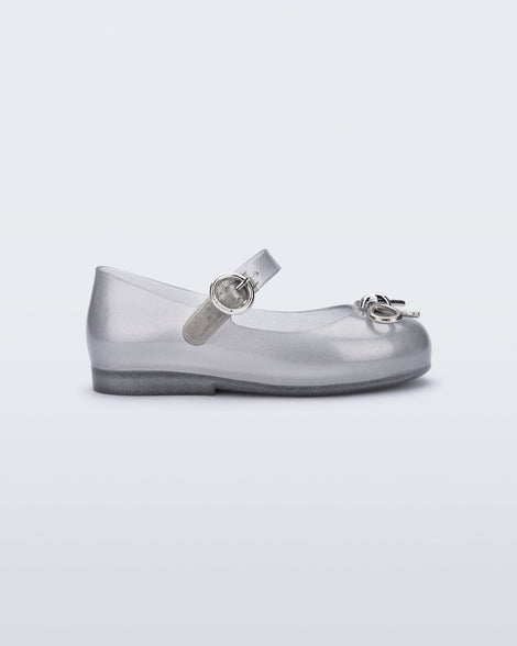Side view of a silver Sweet Love Chrome baby flat with metallic silver bow and buckle