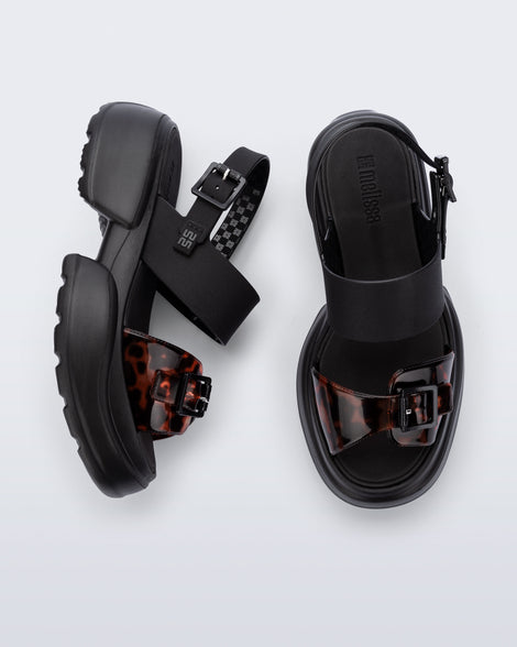Top and side view of a pair of black Push platform Sandals with tortoise colored strap